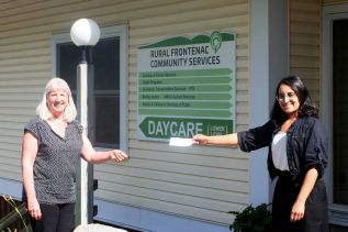 Amrit Kaillon (r) presenting a cheque for over $3,000 to Louise Moody (l) from Rural Frontenac Community Services (RFCS). The money came from surplus revenue from holiday dinners prepared by the Caremongering Sharbot Lake and Area group and from cash donations. The Frontenac Transportation Program, which is run by RFCS, continues to provide delivery services for shut-ins